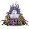 An elegant urn arrangement designed to create a peaceful, contemplative garden atmosphere.