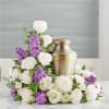 This arrangement features fluffy white mums that provide a solid, peaceful base