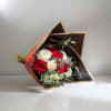 An elegant bouquet of 6 red roses and 6 white roses, wrapped
