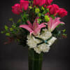 A tall arrangement of one dozen hot pink roses, a hydrangea and