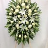 This arrangement focuses on the heavenly white blooms standing watch at a