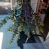 Hanging bundle of eucalyptus with small purple flowers