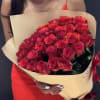 A stunning arrangement of fresh, premium red roses, carefully selected for their