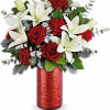Red roses and white lilies in a red vase