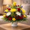 Bright, celebratory color greets the recipient with this rounded flower arrangement-perfect as