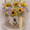 This radiant arrangement is a vibrant tribute for Mother&rsquo;s Day. The sunflowers