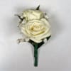 Two ivory-white spray roses are clustered tightly together in this white spray
