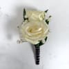 Two ivory-white roses create the refined focal point of Onyx Boutonniere, a