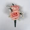 Two pale blush roses sit snugly together in this Rose Quartz boutonniere