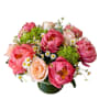 Coral peony, peach roses, green hydrangeas and chamomile designed in a glass