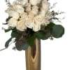 A rounded cluster of cream and blush roses creates an elegant, romantic