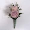 Soft pale lavender roses take center stage in this Amethyst boutonniere, a