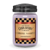 Lavender-colored jar candle with black lid and checkered label