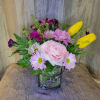 A cheerful spring gathering of pinks, purples, and sunny yellow made to