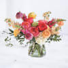 Bright Mix is a vibrant, garden-inspired floral arrangement designed with bold color