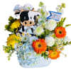A playful cow cutout peeks out from a cheerful cluster of blooms-this