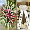 A tall, formal standing sympathy spray designed for funeral and memorial services