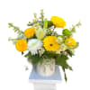 Sunny yellow gerbera daisies and round yellow chrysanthemums create an immediately cheerful