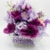 Soft satin-like roses and clustered blooms in purple, lavender, pink and white