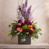 Tall lavender and purple stock spikes give this colorful arrangement in a