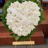 Arrangement is designed on an easel and accented with satin ribbon
Measures approximately