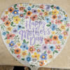 A cheerful heart-shaped foil balloon celebrating Mom makes a bright, joyful statement