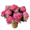 Pink peony bouquet in a tan vase