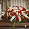 The Graceful Casket Spray from FloralFabulous is a classic and elegant tribute