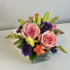 Yellow Lilies, Pink Roses, Bright Colored Pixies, Mums, Hypericum Berries, Yellow Solidego
