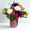A Bright and elegant mix of white roses, purple carnations and yellow