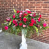 A bold, celebratory display of pink and red florals that makes a