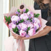 Embark on a journey of blissful beauty with our bouquet featuring a