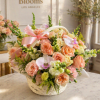 A soft, garden-fresh impression greets the recipient with this rounded flower arrangement-perfect