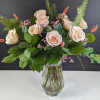 Bouquet of pale blush roses in a clear glass vase