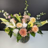 Mixed pastel bouquet in a round glass vase