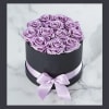Lavender Roses (12) arranged in a hat box.  (we have several