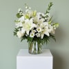 This beautiful all white arrangement is surely to add class to any