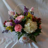 A cheerful mix of pink, white, purple, and yellow blooms makes a