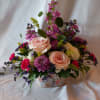 Wildflower Love is symbolic of joy and carefree simplicity. Blush roses and