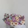 Elegant floral arrangement in a luxurious vase, designed with fresh roses, delicate