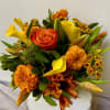 Orange and yellow bouquet with roses, calla lilies, and marigolds