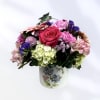 A gardeners delight, this floral arrangement is designed in a keepsake container