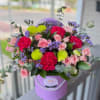Lavender hatbox of blush roses, fuchsia carnations and chartreuse chrysanthemums, lavender statis