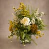 Bright, wild, and wonderfully alive. This garden-inspired arrangement captures the feeling of