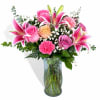Large pink stargazer lilies take center stage in this mothers day bouquet
