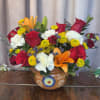 Bright red roses and vibrant orange lilies make a bold first impression