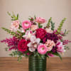 Looking for a ranunculus, roses, and orchid arrangement in Round Rock, TX?