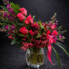 A lush, garden-style floral arrangement that reads like a love letter-bright pink