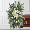 A collection of bold blue flowers shares a tribute that words cannot