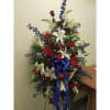 Fitting tribute for the person who served their country. A standing spray